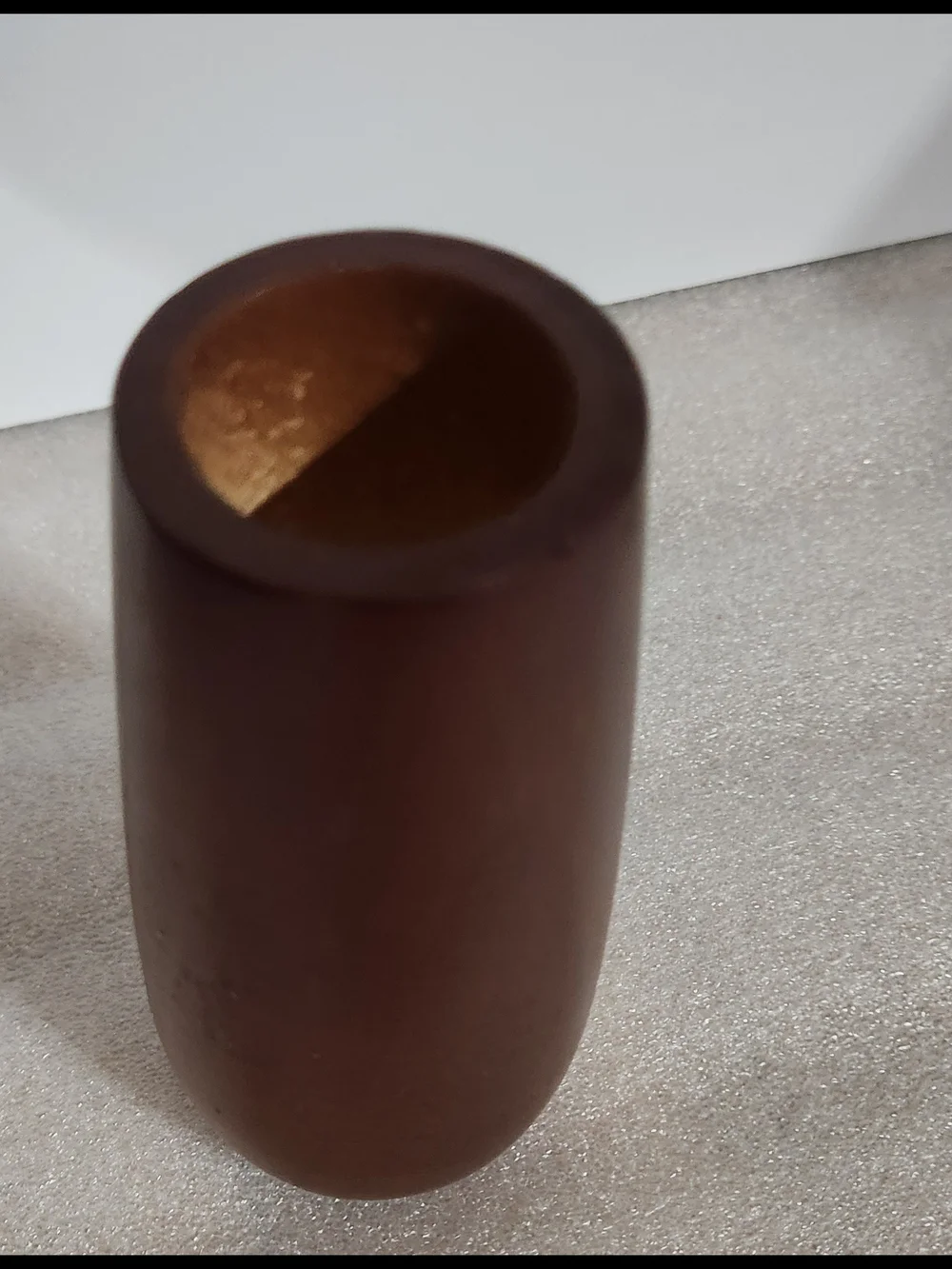 Vintage, mid-century modern style candle holder is crafted from turned wood with